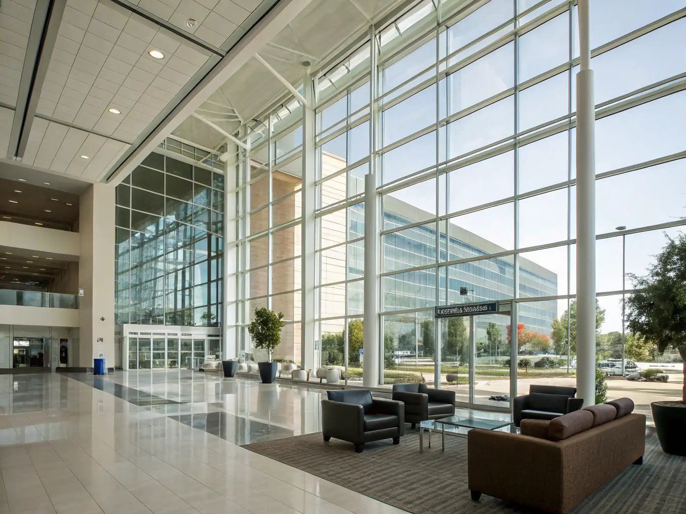 A modern conference center with large windows and a view of the mountains in Whistler Heme.