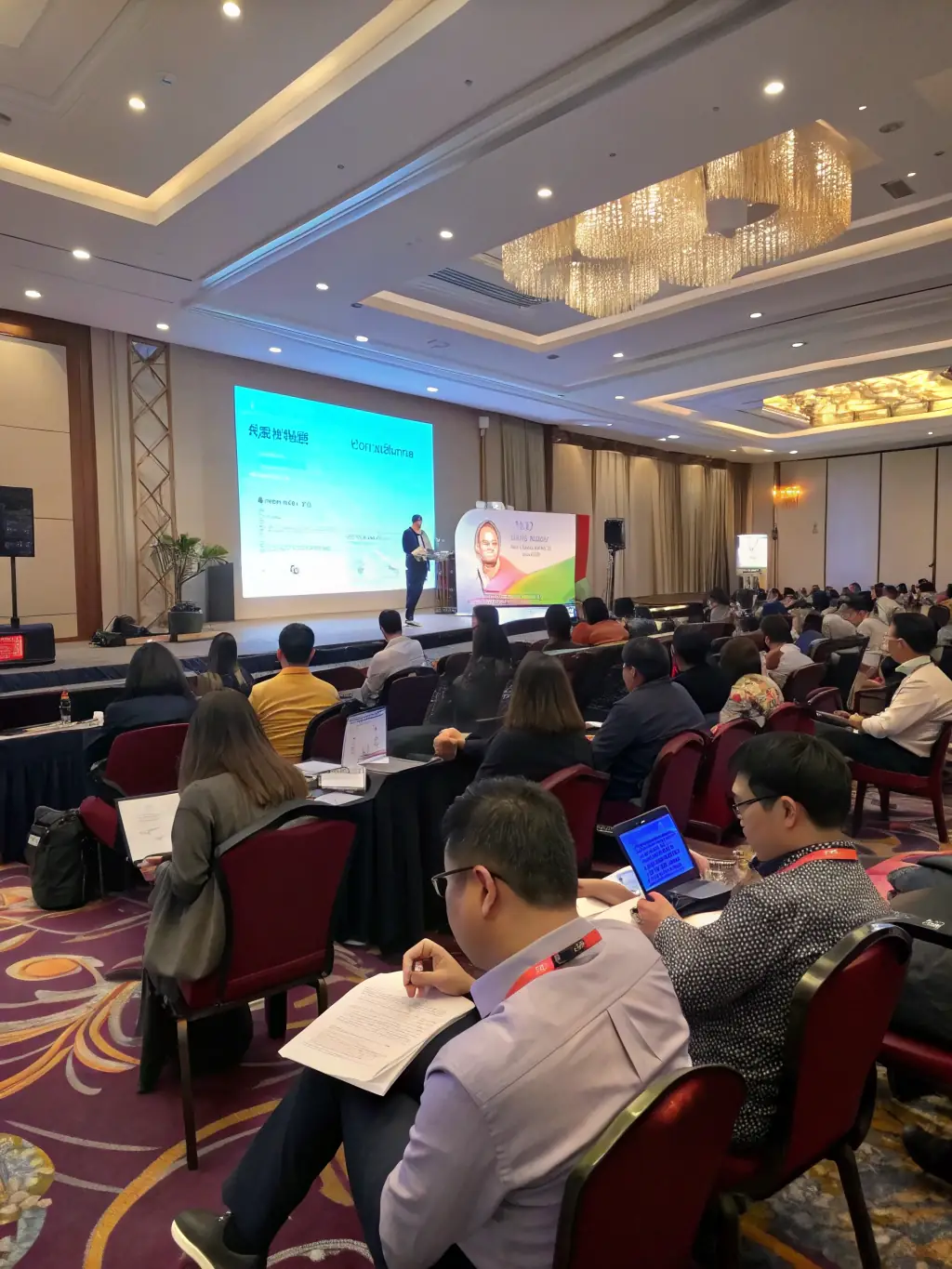 A conference session in progress at Whistler Heme, with attendees actively participating in a workshop focused on the latest advancements in hematology.